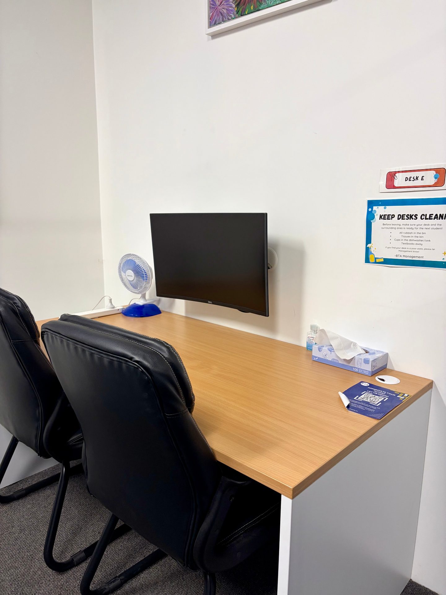 Coworking space at Northern Beaches Coworking Mona Vale - hot desks with monitors and local artwork